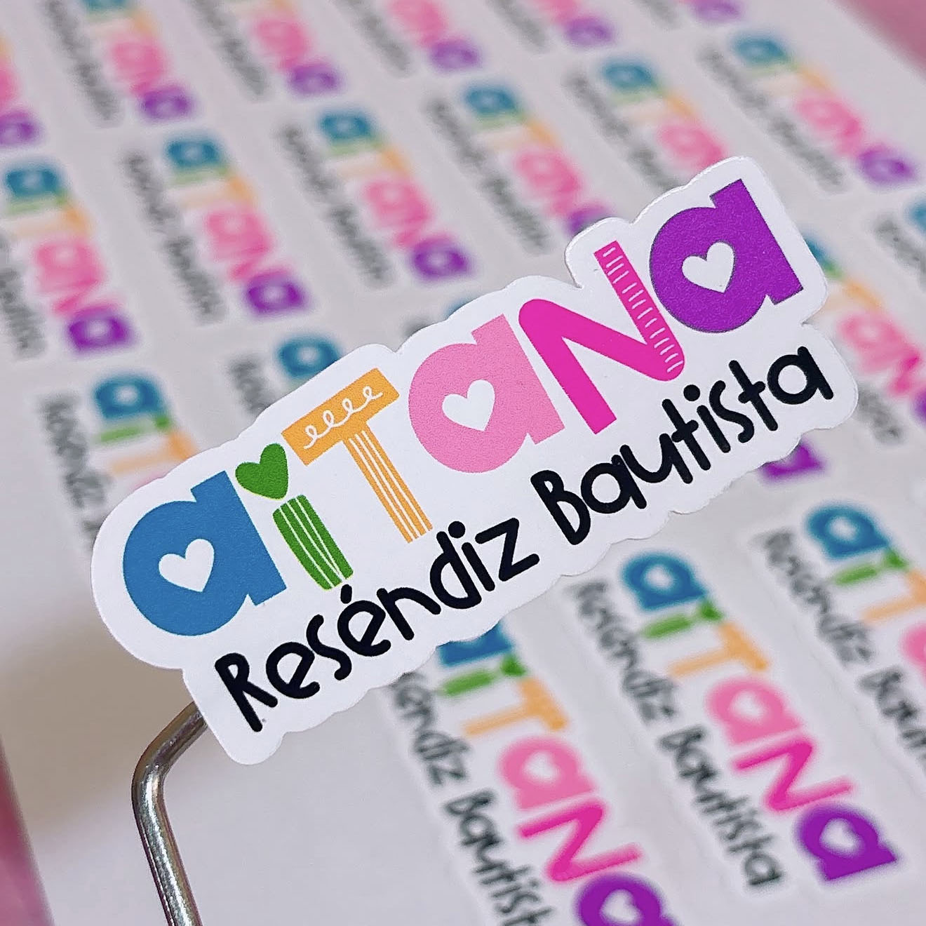 Colorful school label sticker with the name Aitana in the Playful font by Design Pixie